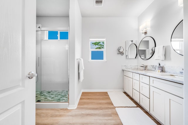 9 Fern Pl, Lahaina, HI 96761 - full bathroom with double vanity, a shower stall, a sink, and wood finished floors