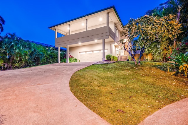 9 Fern Pl, Lahaina, HI 96761 - contemporary home with a yard, a garage, stairway, concrete driveway, and stucco siding