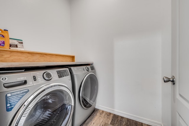 9 Fern Pl, Lahaina, HI 96761 - washroom featuring baseboards, laundry area, washer and clothes dryer, and wood finished floors