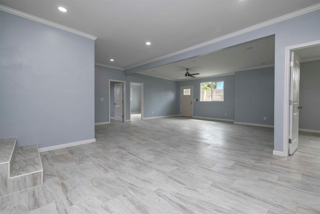 spare room featuring ceiling fan and crown molding