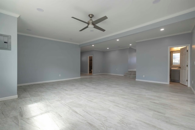 empty room featuring ceiling fan and crown molding