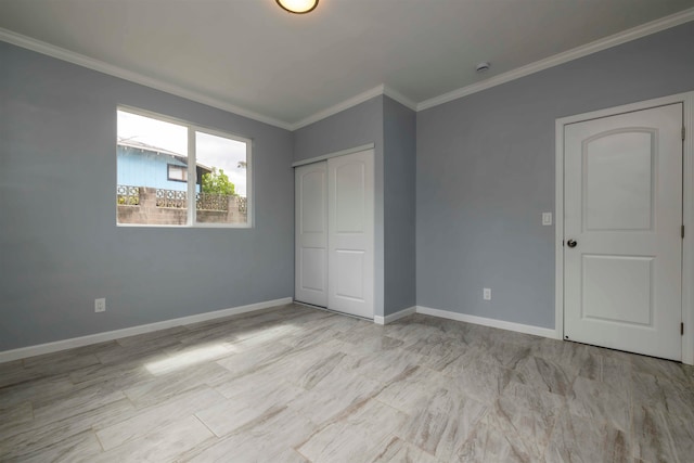 unfurnished bedroom featuring a closet and crown molding