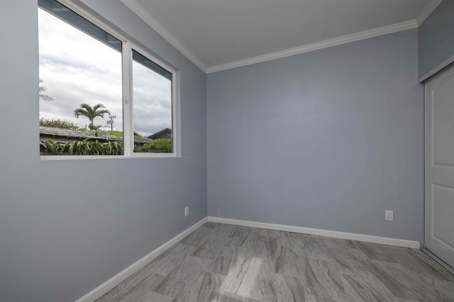 spare room with crown molding