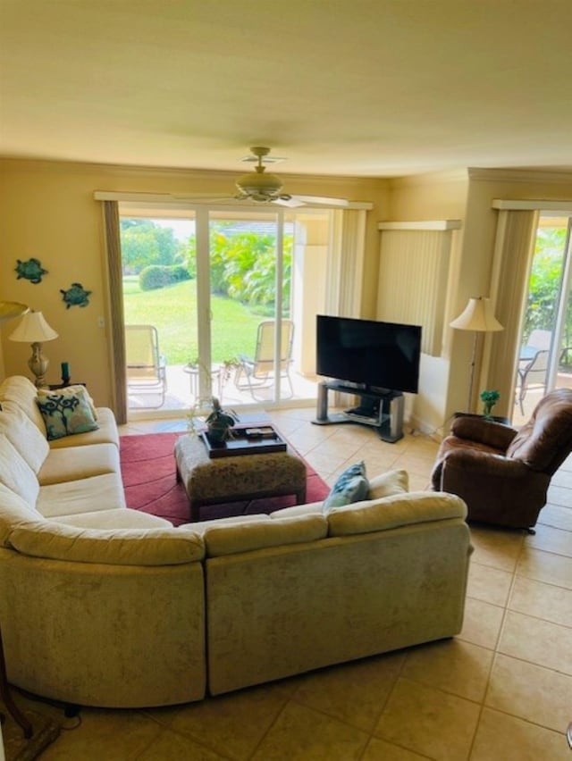 living room with ceiling fan and tile patterned floors