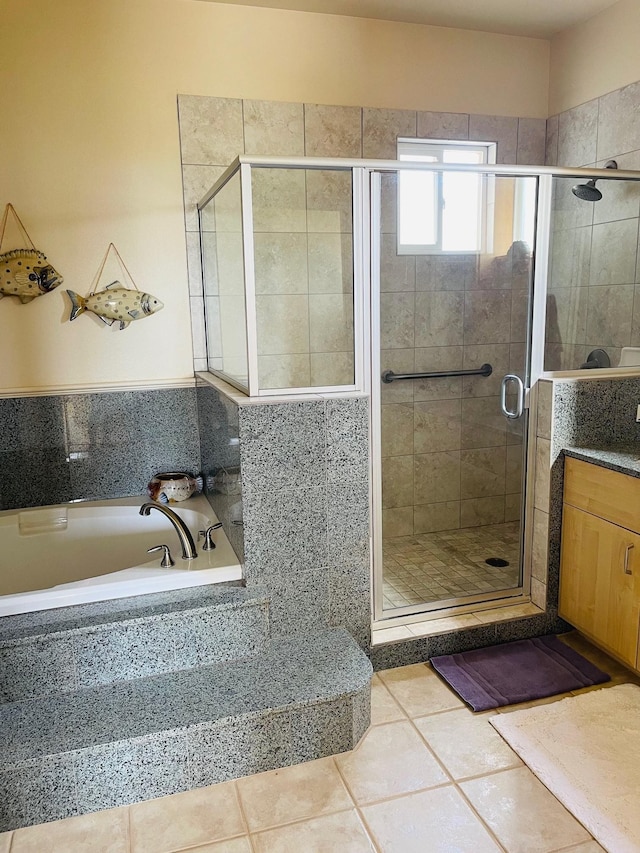 bathroom featuring vanity, tile patterned flooring, and independent shower and bath