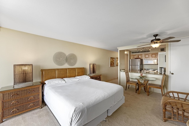 carpeted bedroom featuring stainless steel refrigerator and ceiling fan