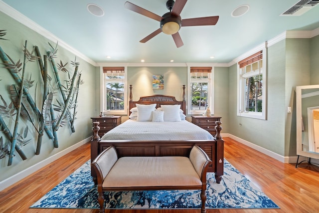 161 Wailea Ike Pl Unit D201, Kihei, HI 96753 - bedroom with baseboards, light wood-type flooring, recessed lighting, a ceiling fan, and crown molding