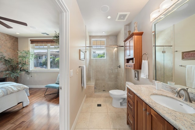 161 Wailea Ike Pl Unit D201, Kihei, HI 96753 - full bathroom featuring ensuite bath, a ceiling fan, baseboards, vanity, and a shower stall