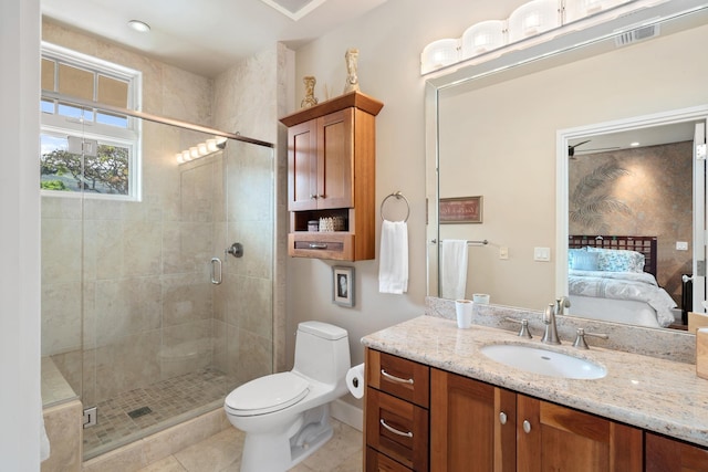 161 Wailea Ike Pl Unit D201, Kihei, HI 96753 - full bathroom featuring vanity, ensuite bathroom, a shower stall, toilet, and tile patterned flooring