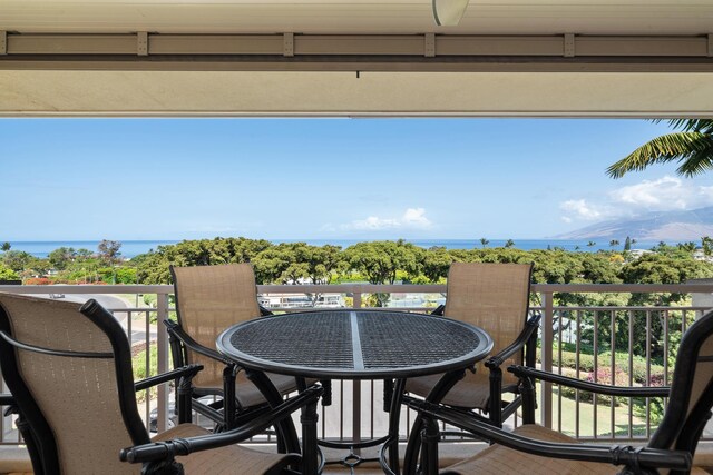 161 Wailea Ike Pl Unit D201, Kihei, HI 96753 - balcony with outdoor dining space and a water view
