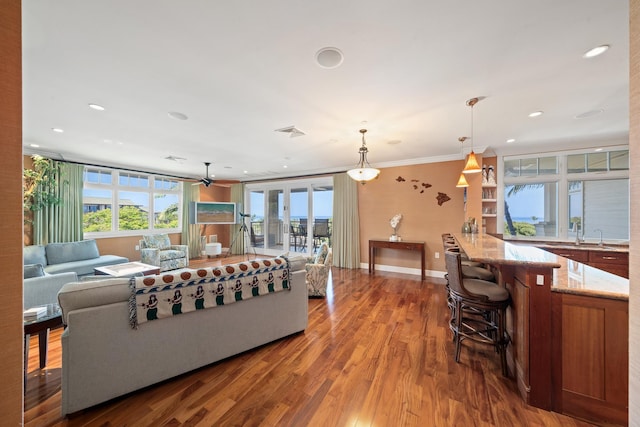 161 Wailea Ike Pl Unit D201, Kihei, HI 96753 - living room featuring wood finished floors, baseboards, a ceiling fan, recessed lighting, and ornamental molding