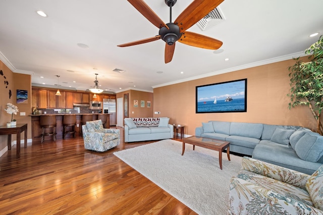 161 Wailea Ike Pl Unit D201, Kihei, HI 96753 - living room with recessed lighting, wood finished floors, ceiling fan, crown molding, and baseboards