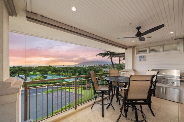 161 Wailea Ike Pl Unit D201, Kihei, HI 96753 - balcony at dusk with a ceiling fan and outdoor dining area