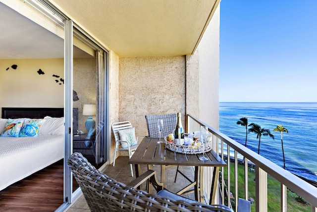 balcony featuring a water view