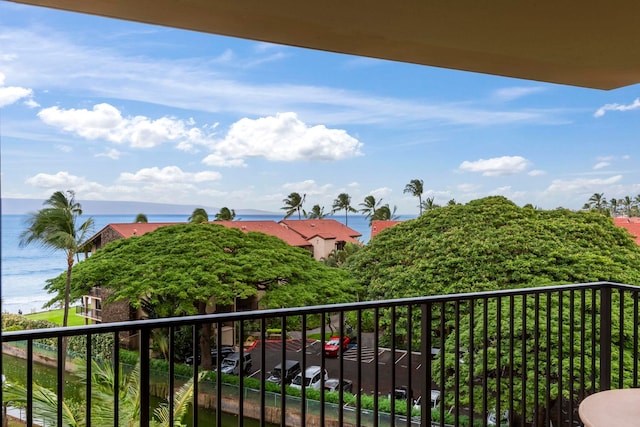 balcony featuring a water view