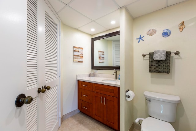 bathroom with vanity, toilet, and tile patterned flooring