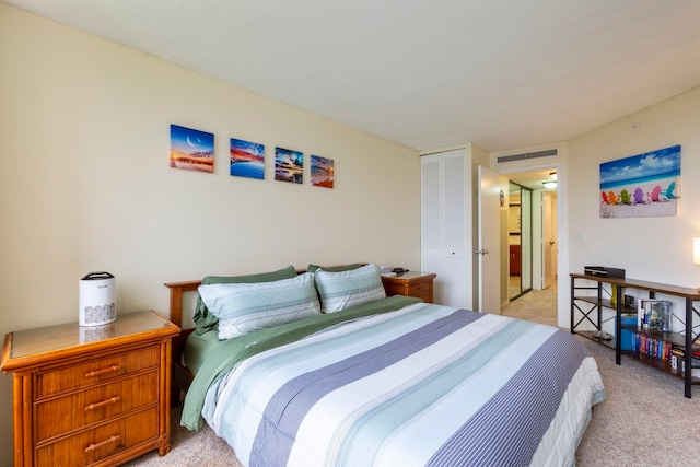 carpeted bedroom with a closet