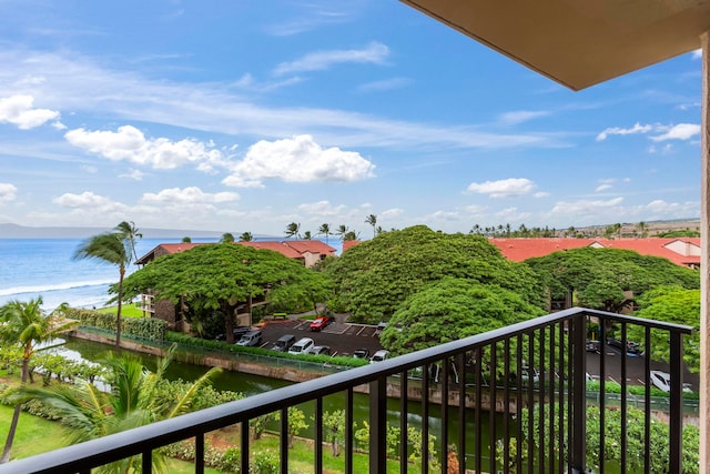 balcony featuring a water view