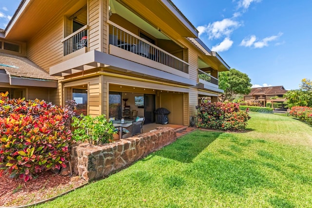 50 Puu Anoano St Unit 503, Lahaina, HI 96761 - back of house with a balcony, a yard, and a patio area