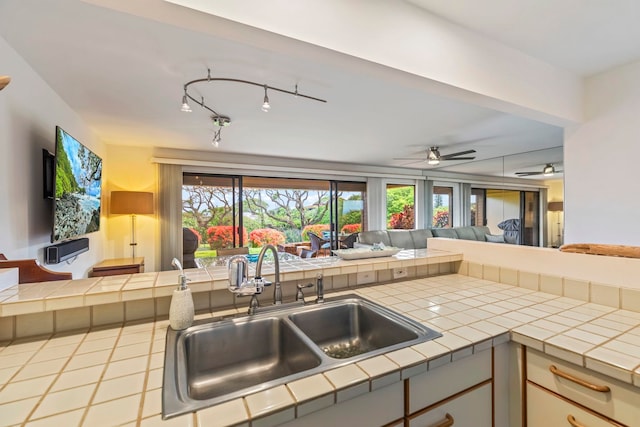 50 Puu Anoano St Unit 503, Lahaina, HI 96761 - kitchen with a sink, tile counters, open floor plan, and ceiling fan