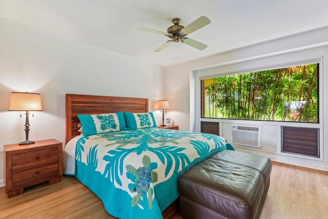 50 Puu Anoano St Unit 503, Lahaina, HI 96761 - bedroom with wood finished floors, a wall mounted AC, and ceiling fan