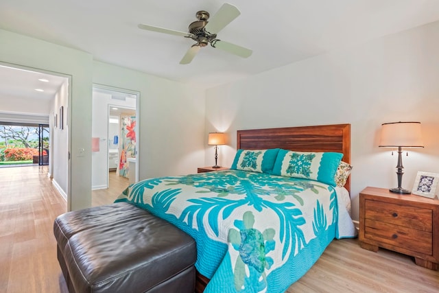 50 Puu Anoano St Unit 503, Lahaina, HI 96761 - bedroom with wood finished floors, ceiling fan, ensuite bath, and baseboards