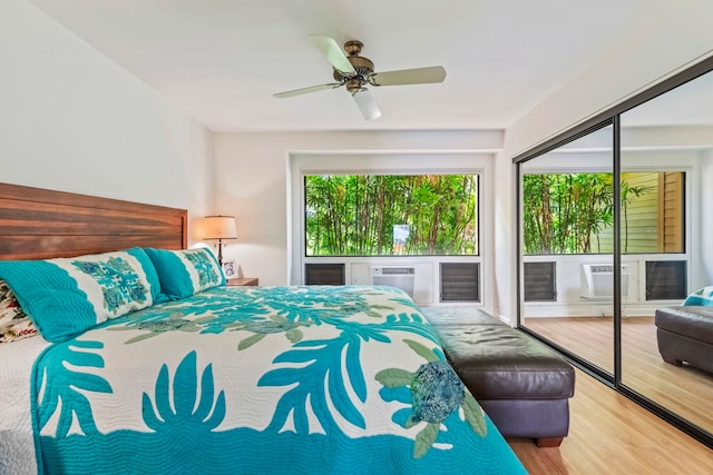50 Puu Anoano St Unit 503, Lahaina, HI 96761 - bedroom featuring wood finished floors, access to exterior, and a ceiling fan