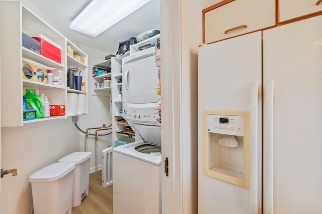 50 Puu Anoano St Unit 503, Lahaina, HI 96761 - laundry area with stacked washer / dryer and light wood-type flooring