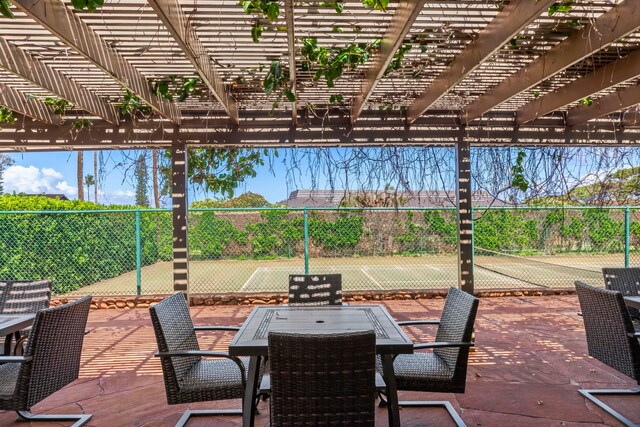 50 Puu Anoano St Unit 503, Lahaina, HI 96761 - view of patio / terrace with a tennis court, a pergola, and outdoor dining area