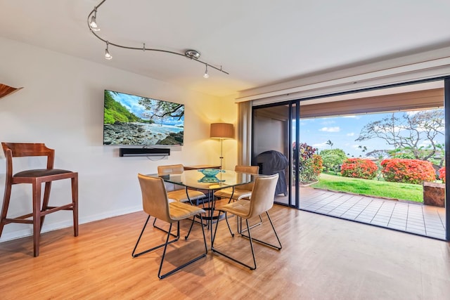 50 Puu Anoano St Unit 503, Lahaina, HI 96761 - dining room with light wood-style floors, baseboards, and rail lighting