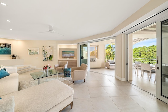 tiled living room with ceiling fan