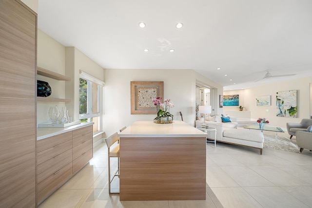 kitchen featuring a center island and light tile patterned floors