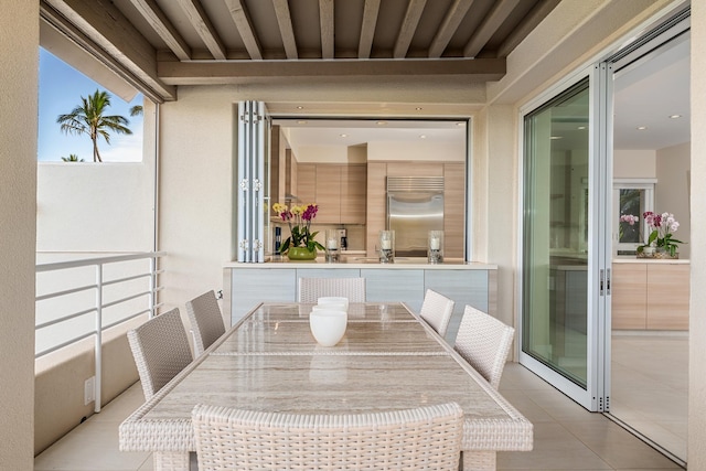 unfurnished dining area with light tile patterned floors