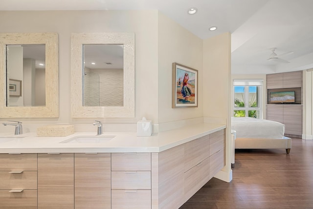 bathroom featuring vanity and hardwood / wood-style floors