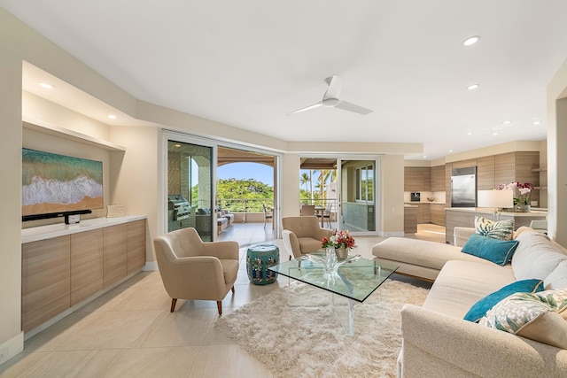 living room with light tile patterned floors and ceiling fan