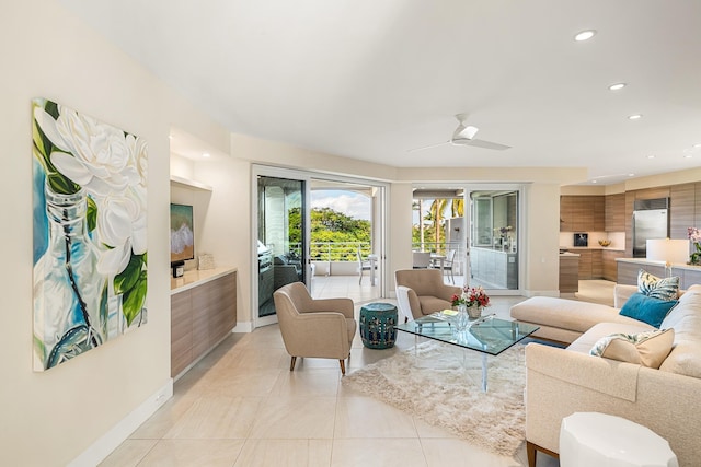 living room featuring ceiling fan and light tile patterned floors