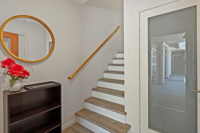 staircase featuring hardwood / wood-style floors