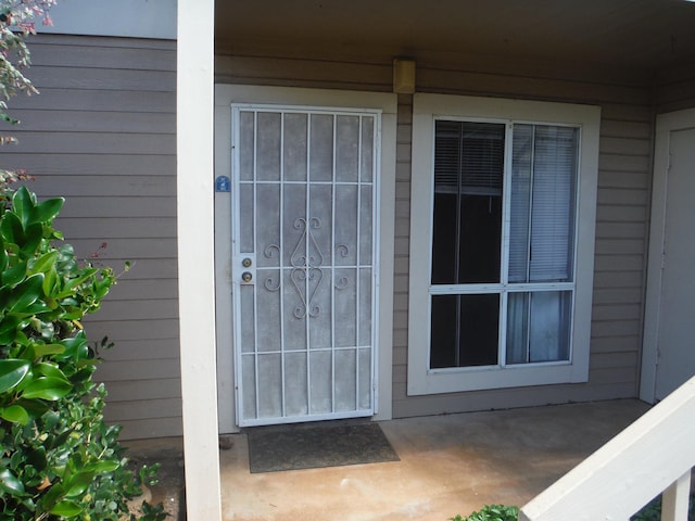 doorway to property with a patio