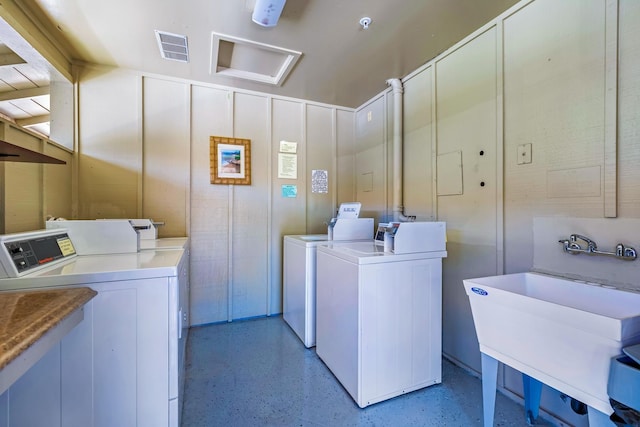 laundry area featuring washer and dryer and sink