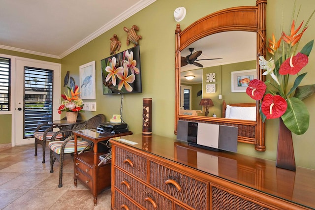 interior space featuring ceiling fan and ornamental molding