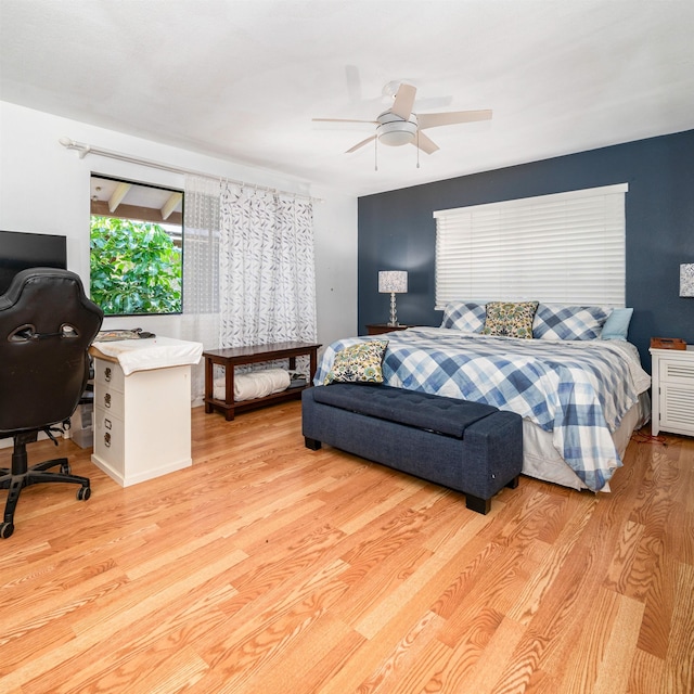 bedroom featuring light hardwood / wood-style floors and ceiling fan