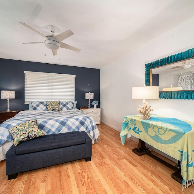 bedroom with wood-type flooring and ceiling fan