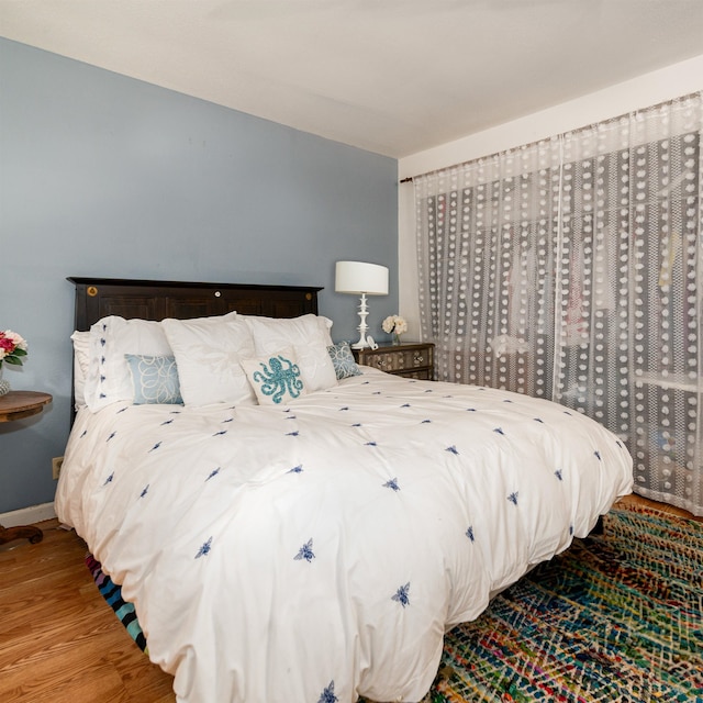 bedroom featuring wood-type flooring