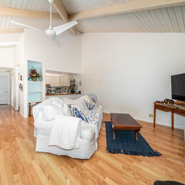 living room featuring wood-type flooring, beam ceiling, and high vaulted ceiling