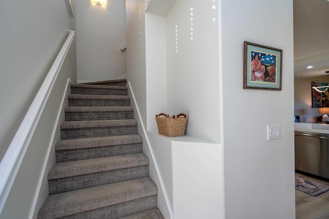 stairs with wood-type flooring