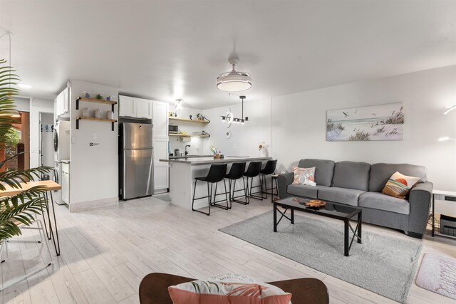 3559 Lower Honoapiilani Rd Unit 709, Lahaina, HI 96761 - living room featuring light wood-style floors
