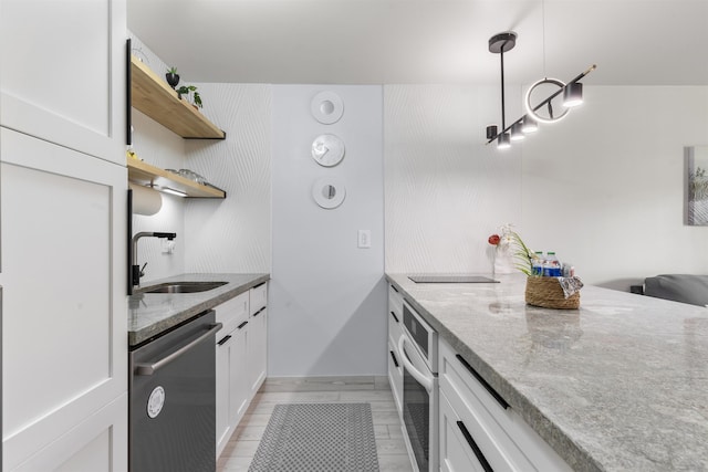 3559 Lower Honoapiilani Rd Unit 709, Lahaina, HI 96761 - kitchen featuring stainless steel dishwasher, open shelves, a sink, oven, and light stone countertops