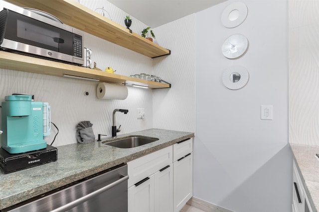 3559 Lower Honoapiilani Rd Unit 709, Lahaina, HI 96761 - kitchen with open shelves, light stone counters, a sink, and appliances with stainless steel finishes