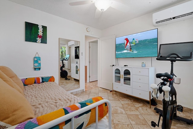 interior space with a wall mounted air conditioner, ceiling fan, and a textured ceiling