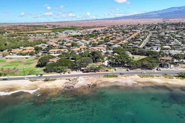 birds eye view of property featuring a water and mountain view